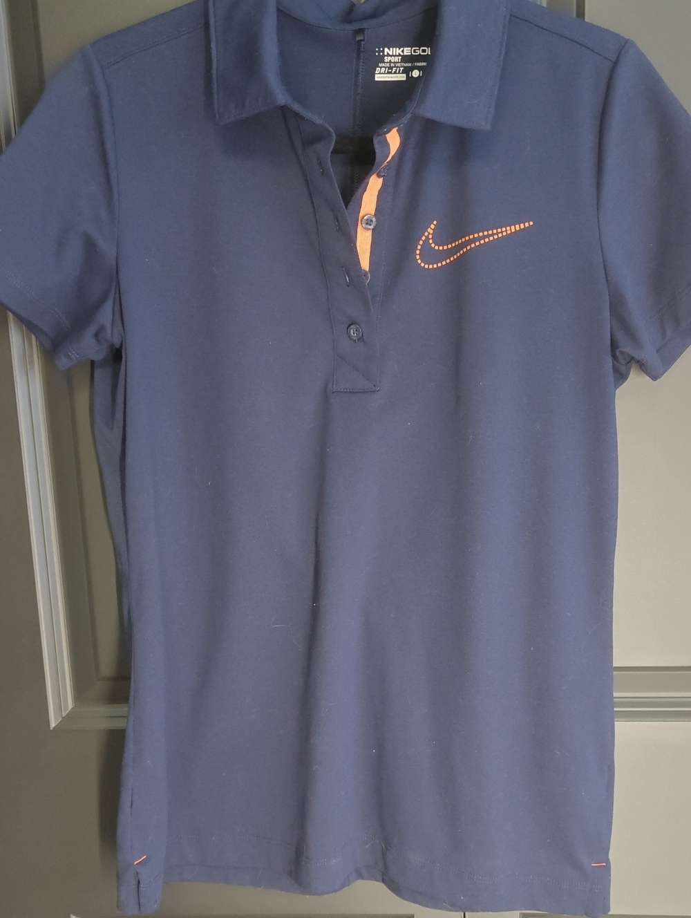 Nike Golf Navy Polo with Orange Swoosh Accent